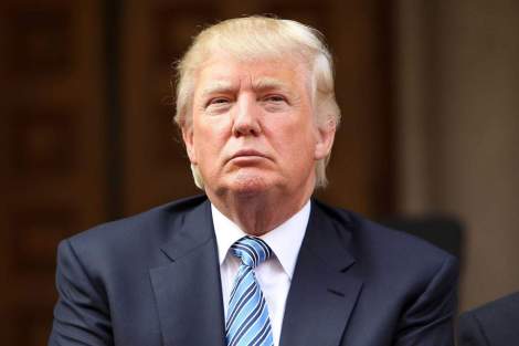 WASHINGTON, DC - JULY 23: Donald Trump listens at the Trump International Hotel Washington, D.C Groundbreaking Ceremony at Old Post Office on July 23, 2014 in Washington, DC. (Photo by Paul Morigi/WireImage)