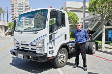 Wrightspeed founder and CEO Ian Wright with a CNG-fueled boosted electric truck at Act Expo 2012 in Long Beach, Calif. Mel Lindstrom photo