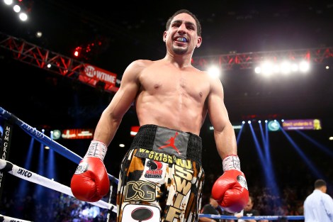 (L-R) Danny Garcia throws a right to the body of Lucas Matthysse during their WBC/WBA super lightweight title fight at the MGM Grand Garden Arena on September 14, 2013 in Las Vegas, Nevada.